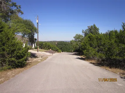 a view of a road with a building in the background