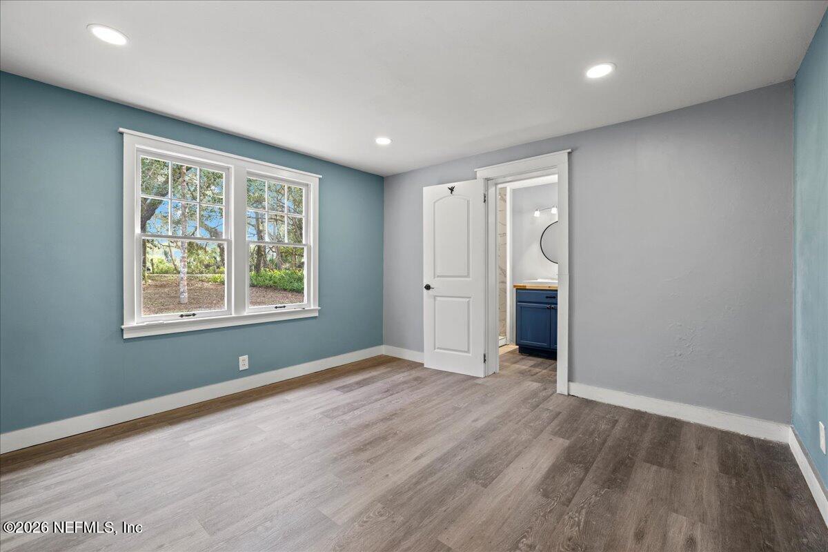 242 Taylor Fury Road Pomona Park, FL 32181 - Photo 15 of 40 wooden floor in an empty room with a window
