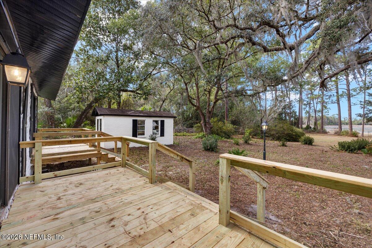 242 Taylor Fury Road Pomona Park, FL 32181 - Photo 23 of 40 a view of a house with backyard and trees
