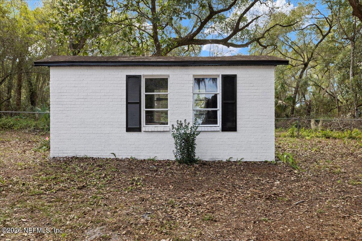 242 Taylor Fury Road Pomona Park, FL 32181 - Photo 25 of 40 a view of a house with a yard