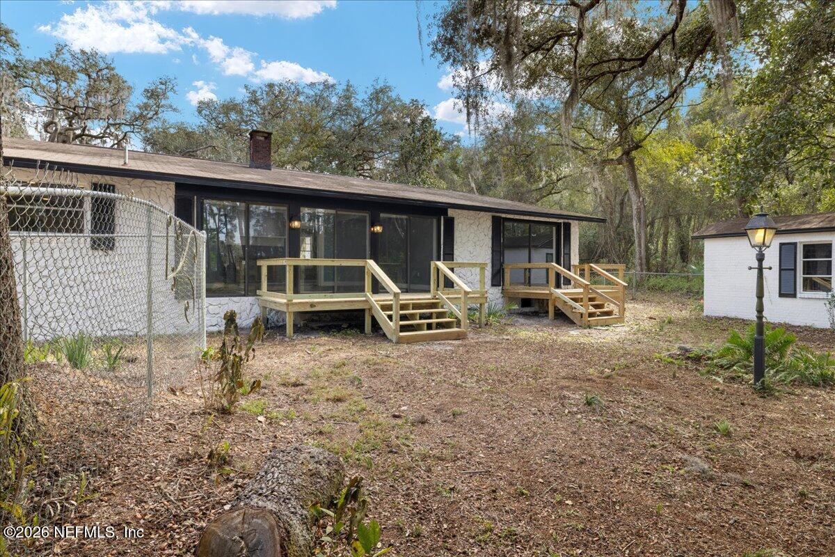 242 Taylor Fury Road Pomona Park, FL 32181 - Photo 29 of 40 a view of a house with a yard