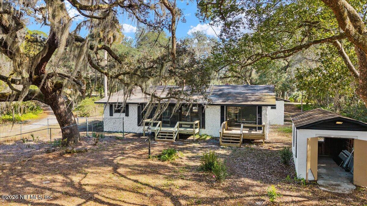 242 Taylor Fury Road Pomona Park, FL 32181 - Photo 32 of 40 a view of a house with backyard and tree