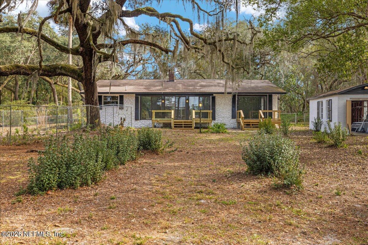 242 Taylor Fury Road Pomona Park, FL 32181 - Photo 35 of 40 a front view of a house with garden