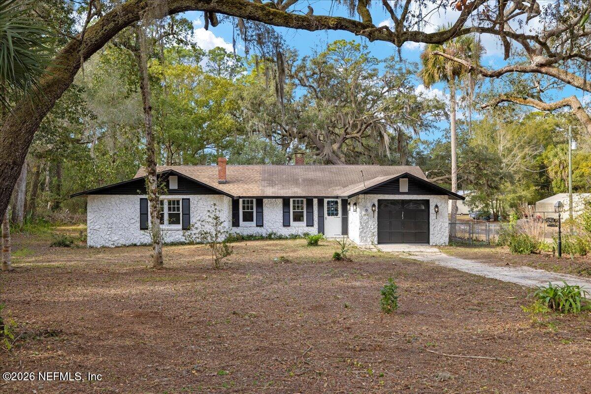 242 Taylor Fury Road Pomona Park, FL 32181 - Photo 39 of 40 a front view of a house with a yard