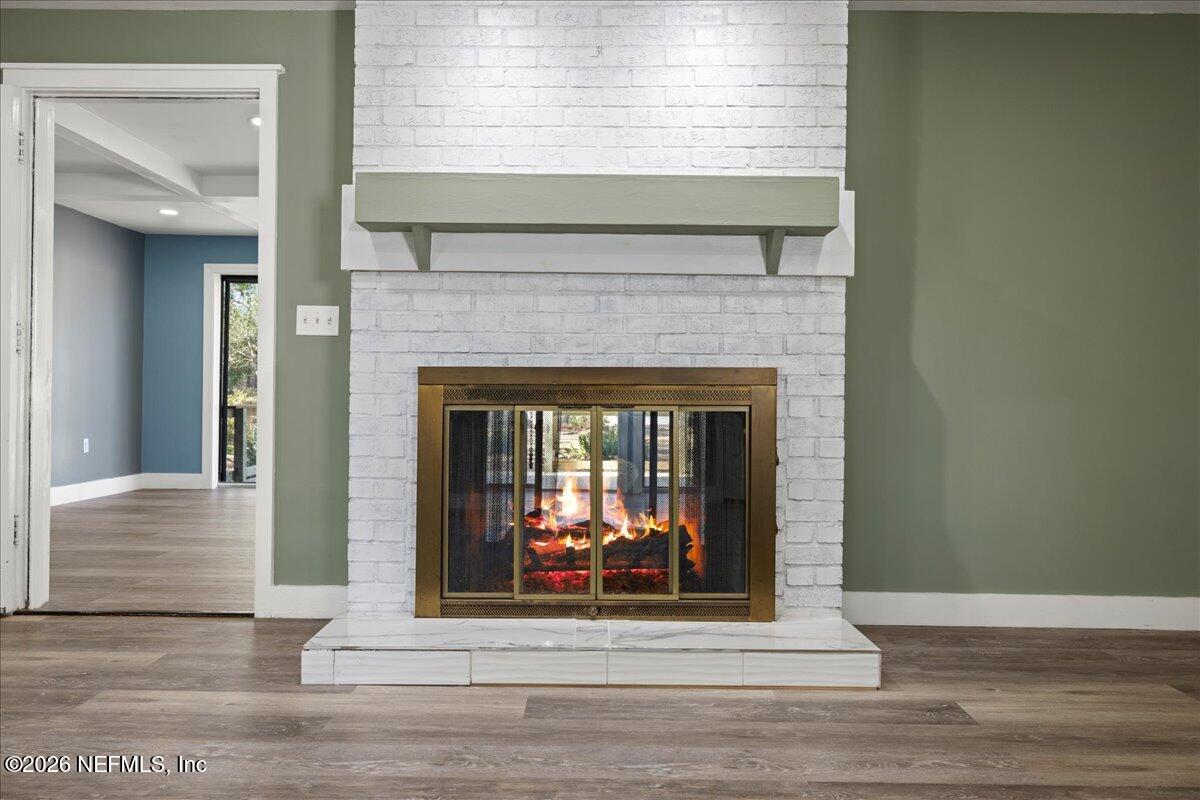 242 Taylor Fury Road Pomona Park, FL 32181 - Photo 5 of 40 a living room with a fireplace