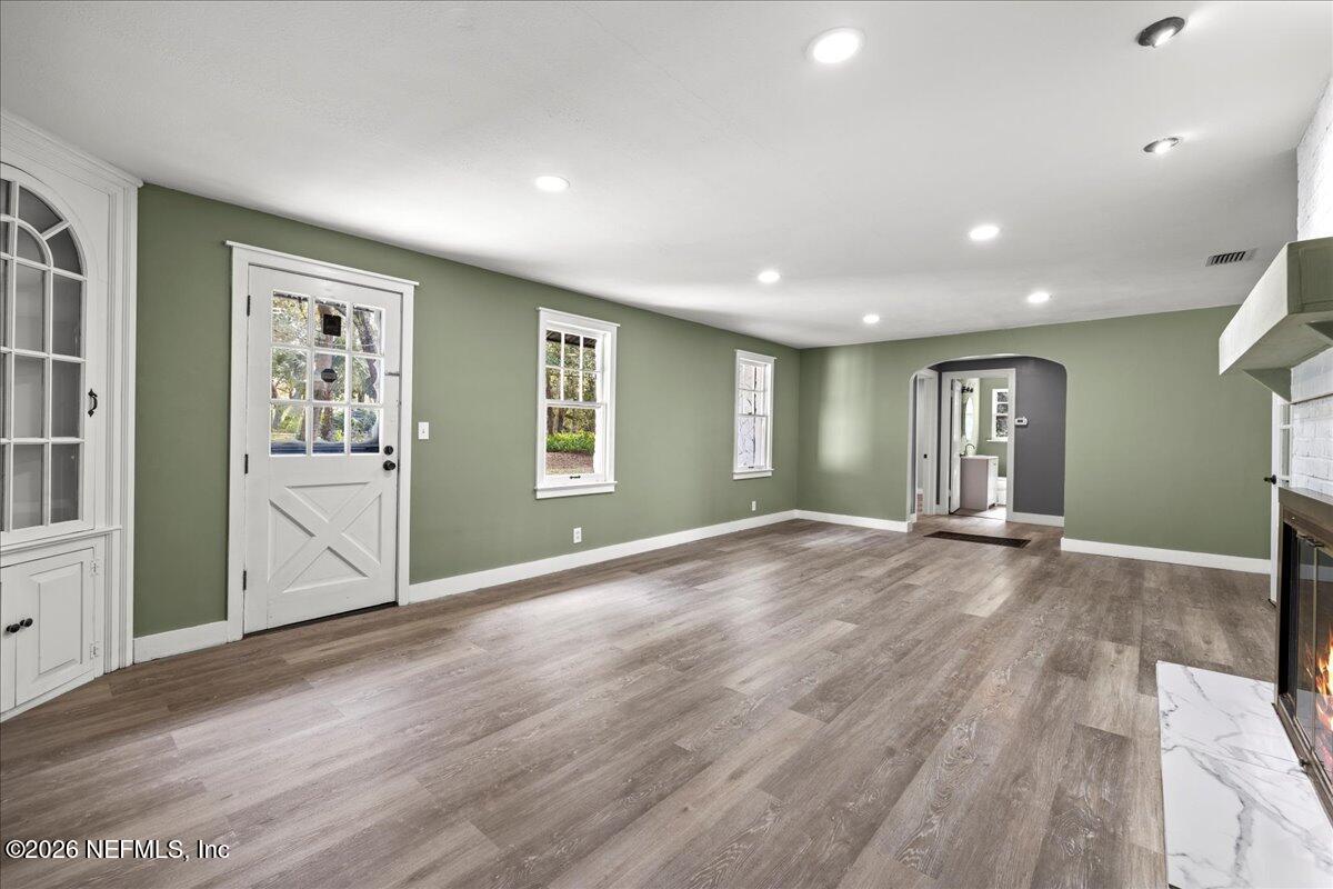 242 Taylor Fury Road Pomona Park, FL 32181 - Photo 7 of 45 a view of an empty room with window and wooden floor