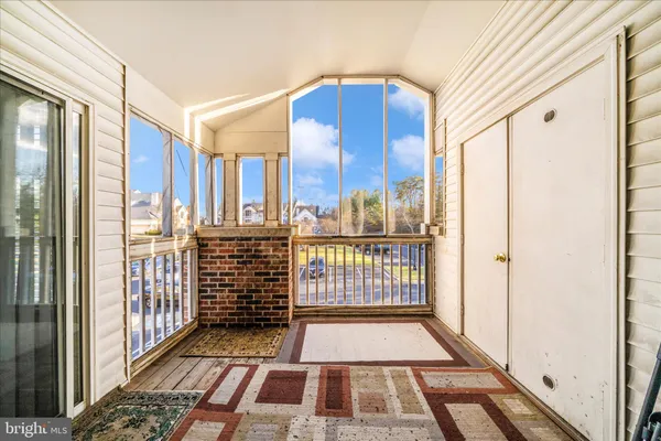a view of a balcony with wooden floor
