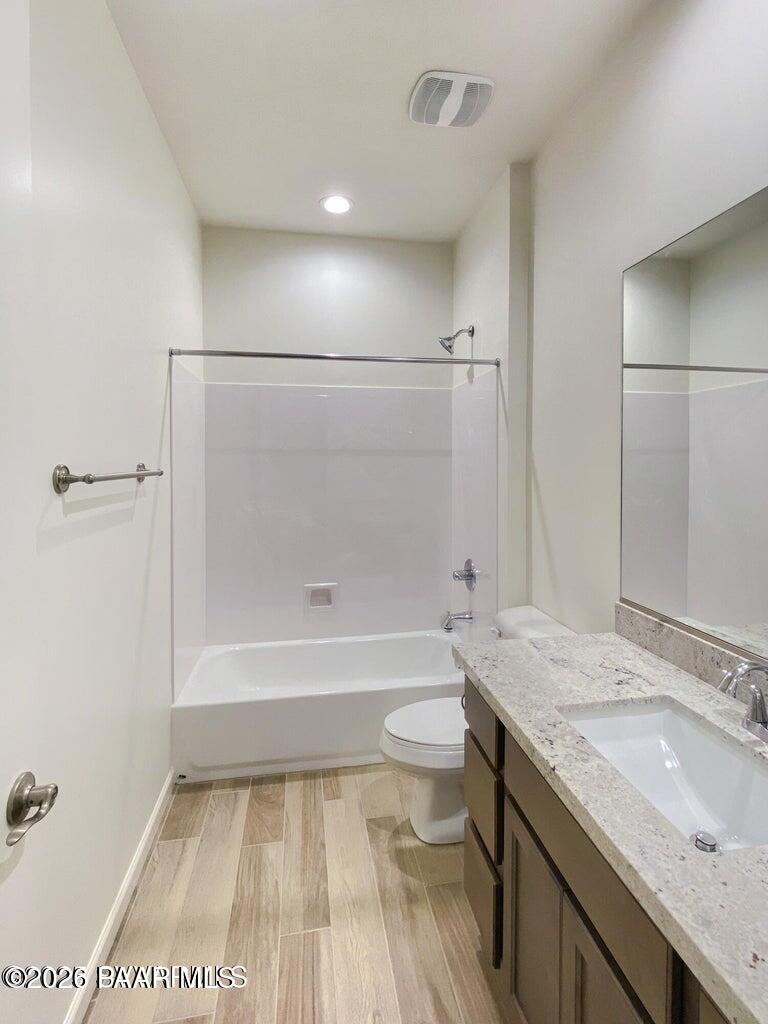 832 Eugene Road Clarkdale, AZ 86324 - Photo 12 of 30 a bathroom with a granite countertop sink a toilet a mirror and shower