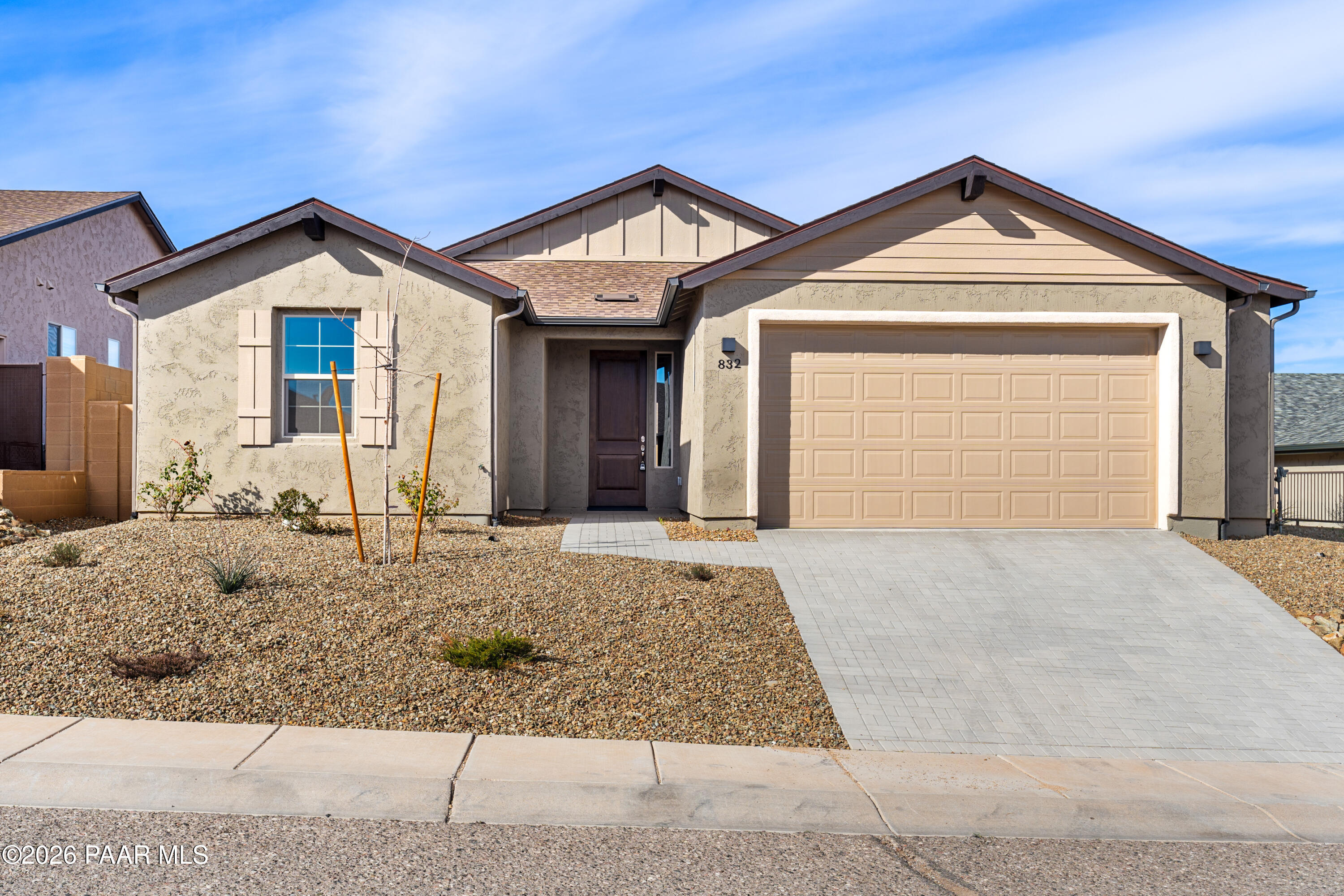 832 Eugene Road Clarkdale, AZ 86324 - Photo 3 of 30 a front view of a house with a yard and garage