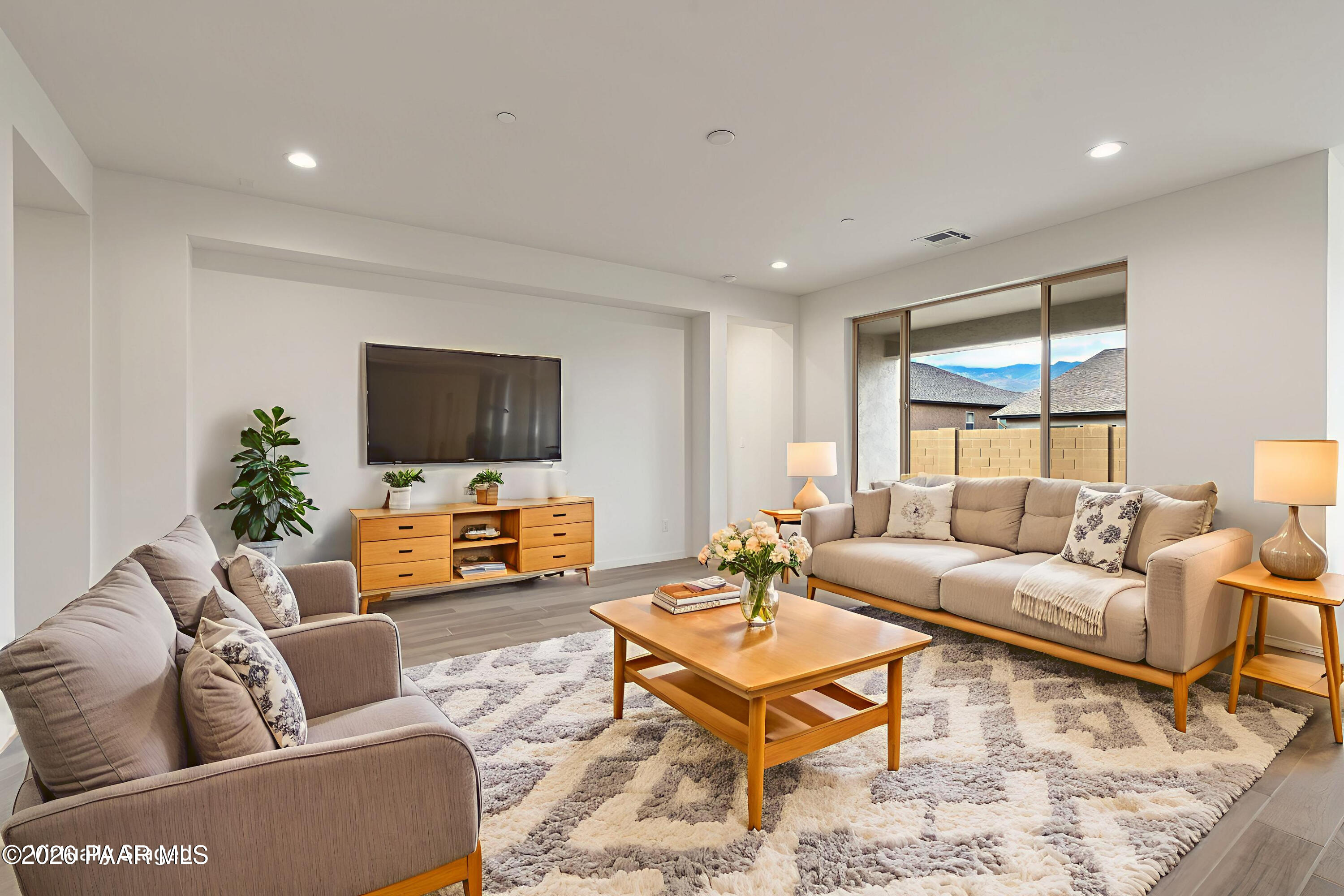 832 Eugene Road Clarkdale, AZ 86324 - Photo 5 of 30 a living room with furniture and a flat screen tv
