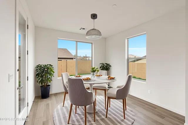 a en suite bathroom with a granite countertop sink and a mirror