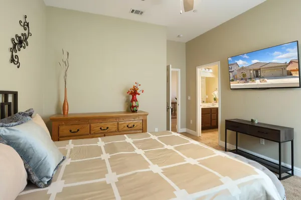 a bedroom with a bed and a dresser