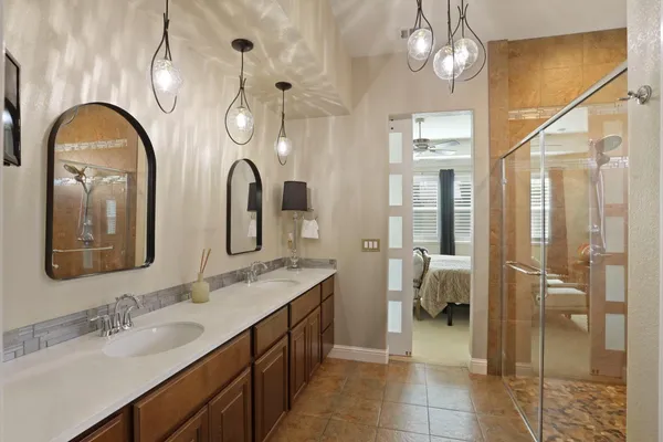 a view of a patio with table and chairs and potted plants