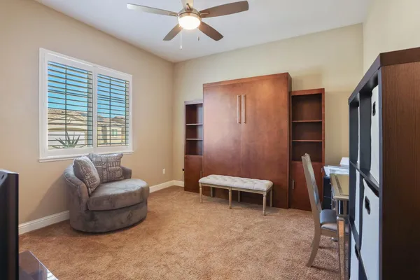 a living room with furniture and a window