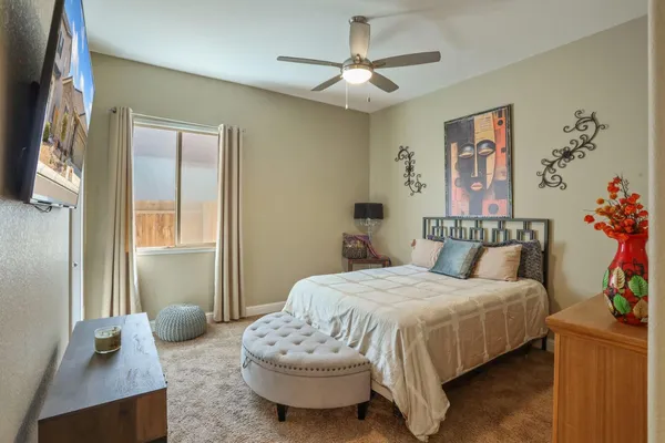 a bedroom with bed and a window