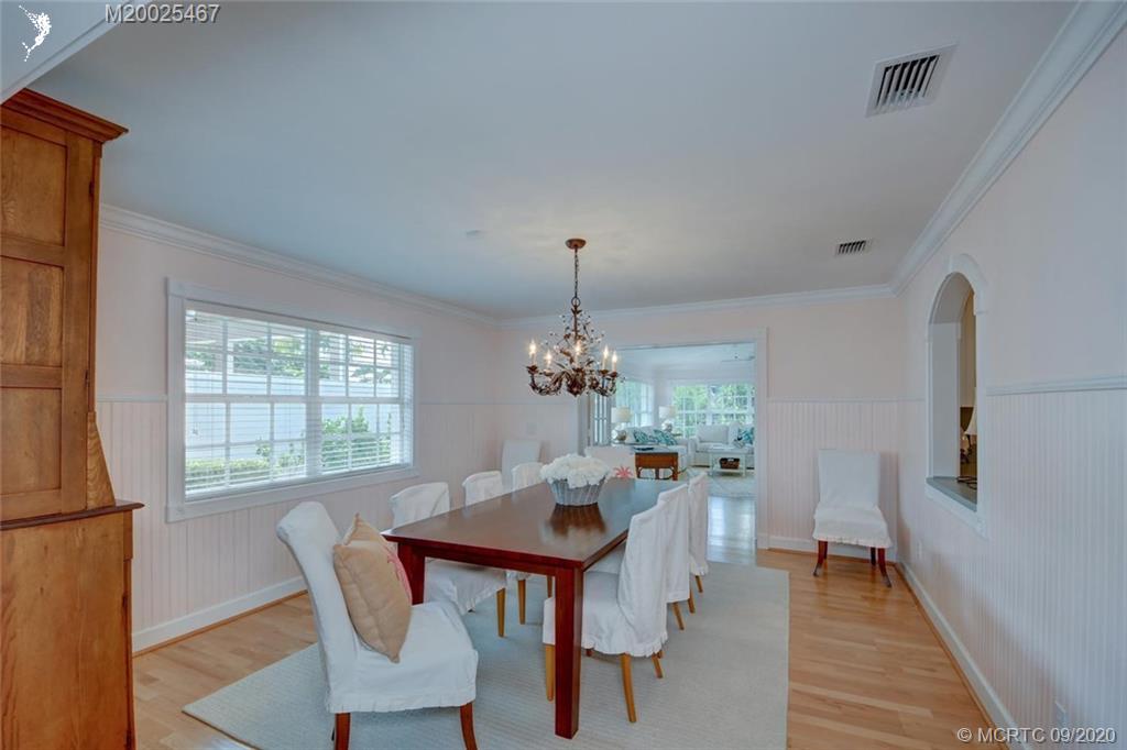 904 Southeast Riverside Drive Stuart, FL 34994 - Photo 19 of 72 a view of a dining room with furniture window and wooden floor