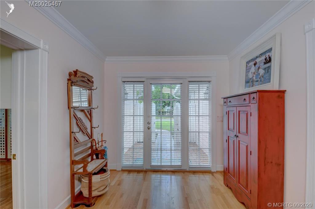 904 Southeast Riverside Drive Stuart, FL 34994 - Photo 28 of 72 a view of a livingroom with wooden floor and stairs