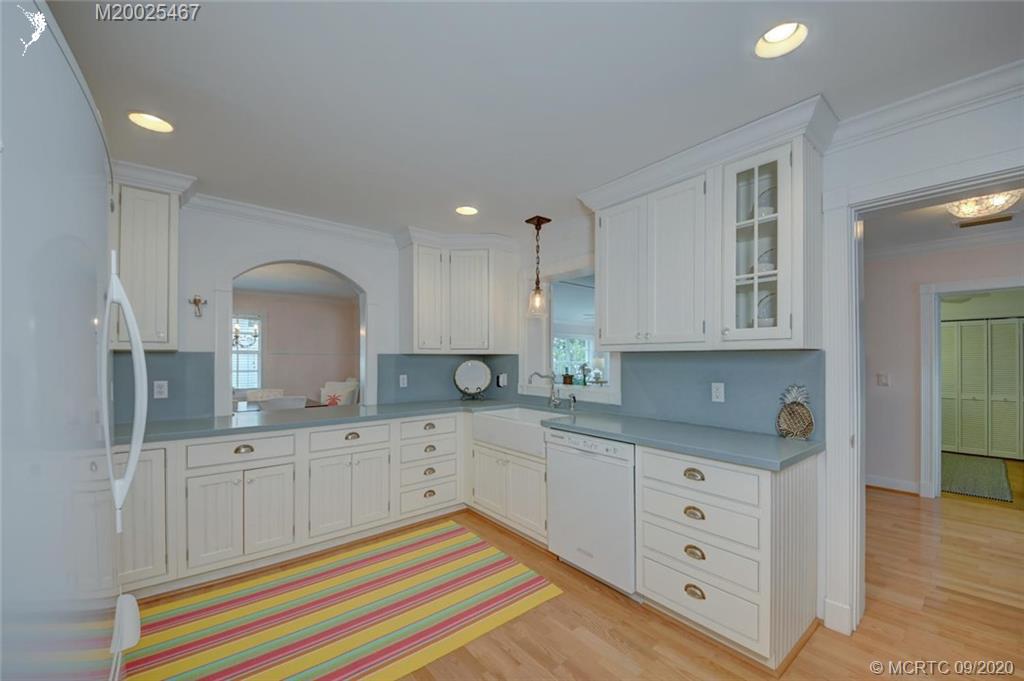 904 Southeast Riverside Drive Stuart, FL 34994 - Photo 32 of 72 a kitchen with granite countertop a sink cabinets and stainless steel appliances