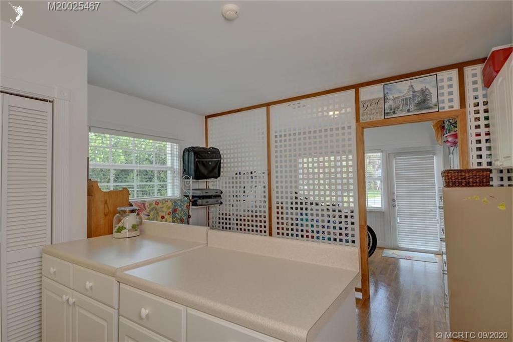 904 Southeast Riverside Drive Stuart, FL 34994 - Photo 39 of 72 a living room with furniture and a flat screen tv
