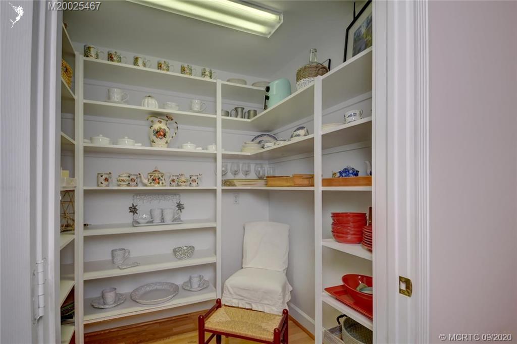 904 Southeast Riverside Drive Stuart, FL 34994 - Photo 42 of 72 a room with a book shelf