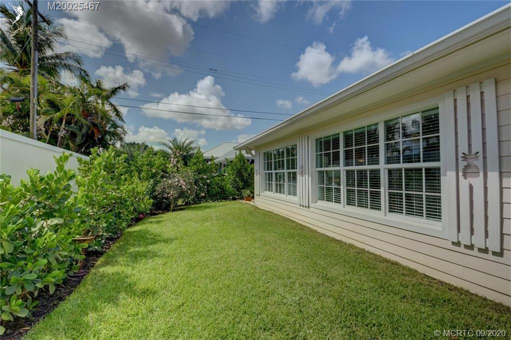 904 Southeast Riverside Drive Stuart, FL 34994 - Photo 55 of 72 a view of a house with a garden