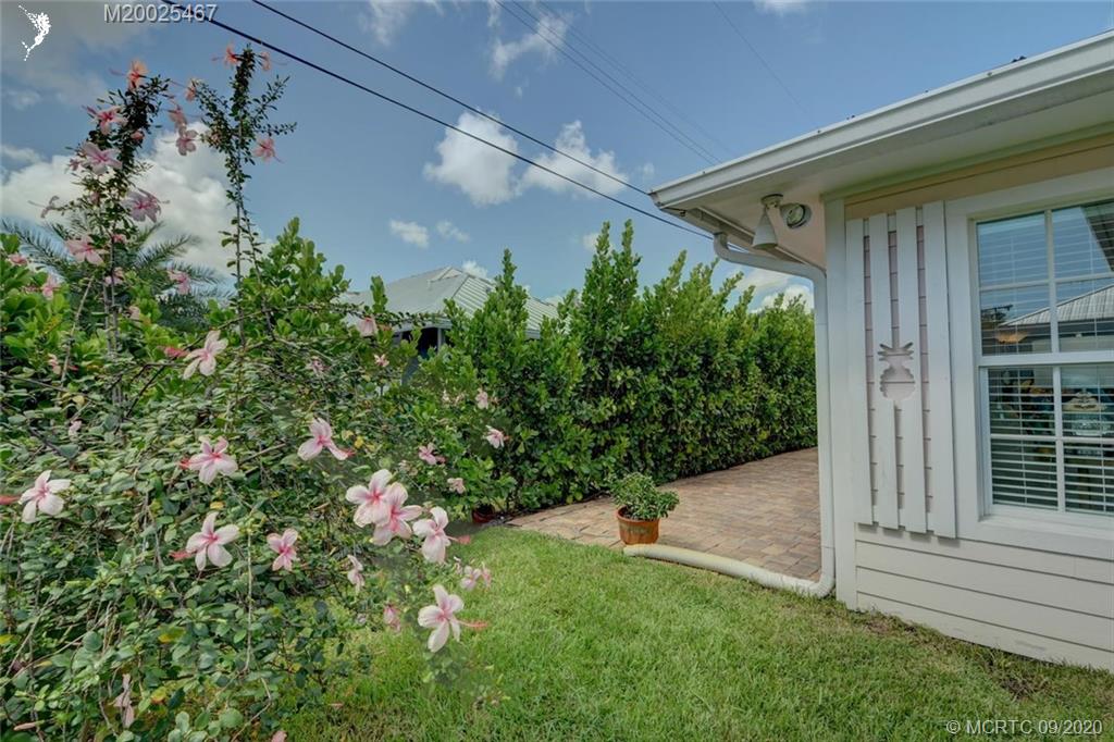 904 Southeast Riverside Drive Stuart, FL 34994 - Photo 56 of 72 a backyard with potted plants