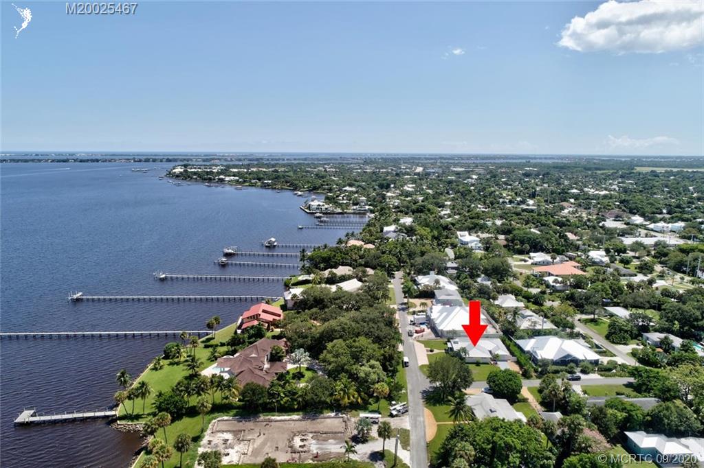 904 Southeast Riverside Drive Stuart, FL 34994 - Photo 61 of 72 an aerial view of a houses with an outdoor space