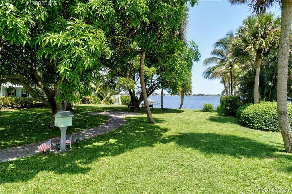 904 Southeast Riverside Drive Stuart, FL 34994 - Photo 70 of 72 a view of a backyard with large trees