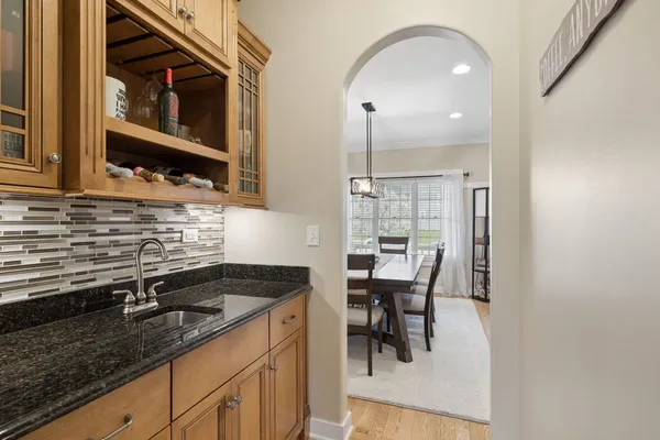 a kitchen with a sink cabinets and window