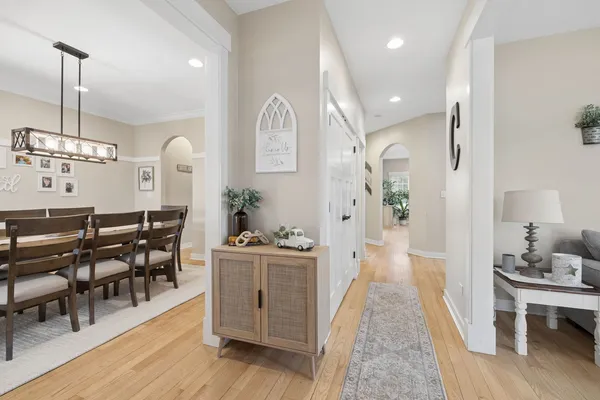 a view of a dining room with furniture and wooden floor