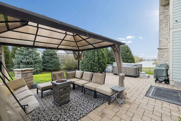 a view of a patio with a table and chairs