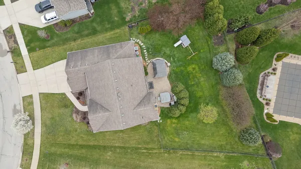 an aerial view of a house with a garden