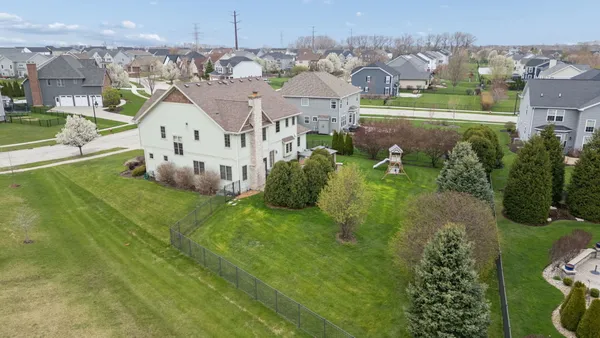 a view of multiple houses with yard