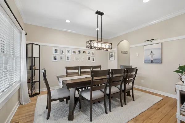 a view of a dining room with furniture window and wooden floor