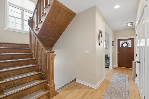 a view of entryway with stairs and wooden floor