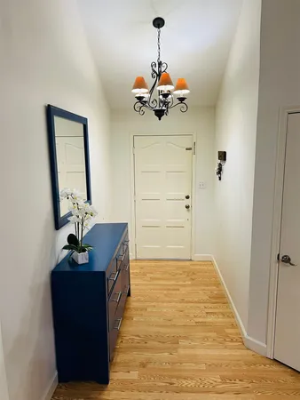 a view of a hallway with front door