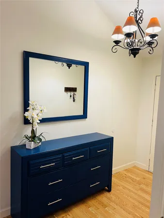 a room with a dresser and a mirror