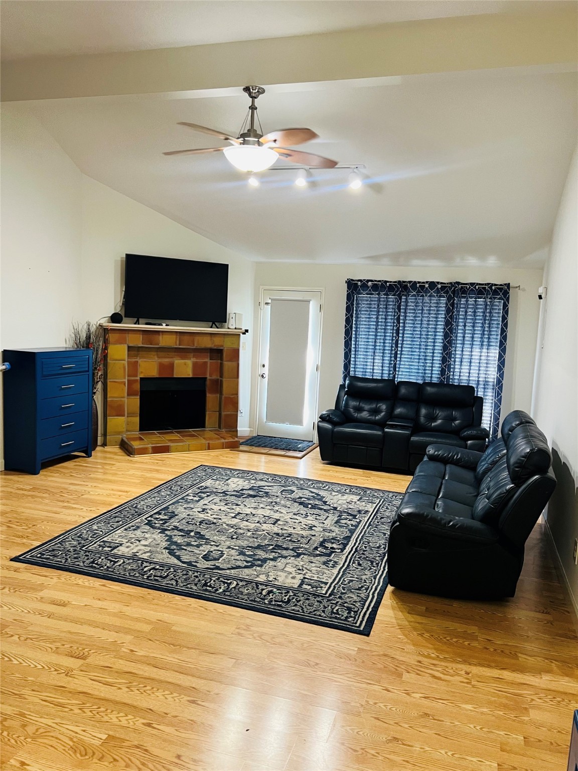 5211 Rivertree Lane Spring, TX 77379 - Photo 7 of 20 a living room with furniture flat screen tv and a fireplace