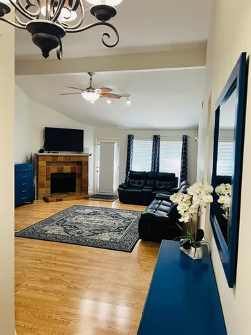 a living room with furniture and a fireplace