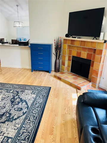 a bedroom with a bed and flat screen tv