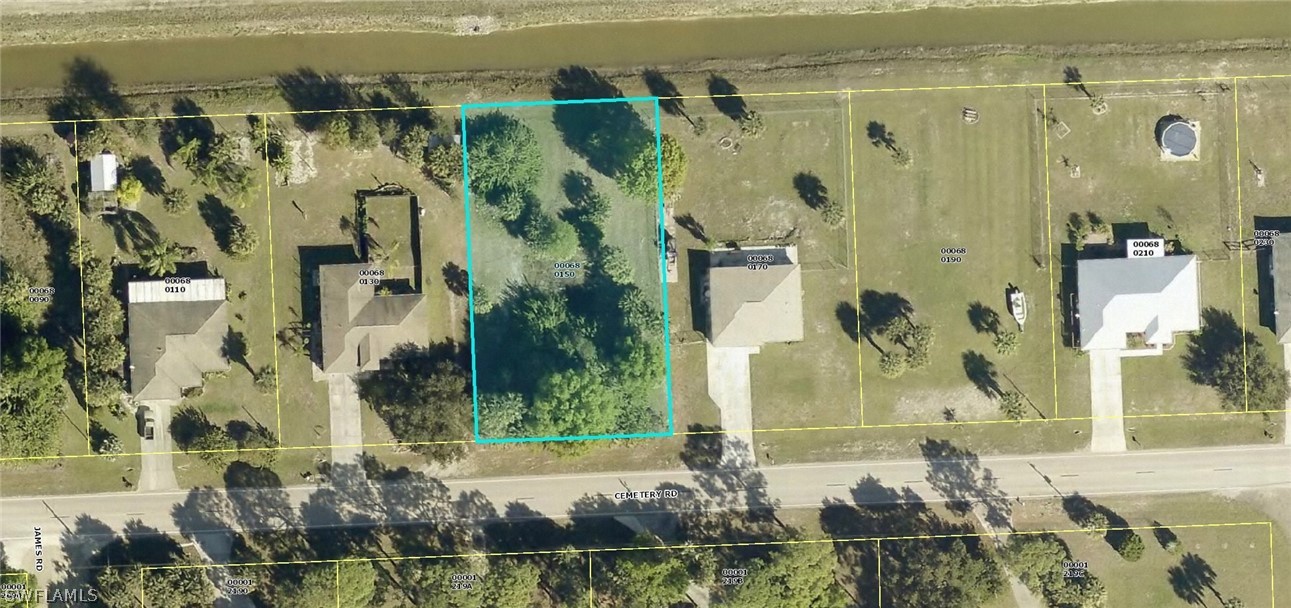 15801 Cemetery Road Fort Myers, FL 33905 - Photo 1 of 1 an aerial view of a house with a garden