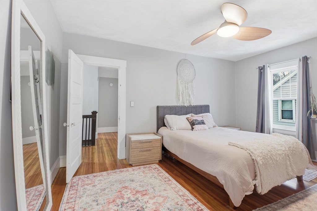 141 Lincoln Road Longmeadow, MA 01106 - Photo 11 of 26 a bedroom with a bed and a chandelier