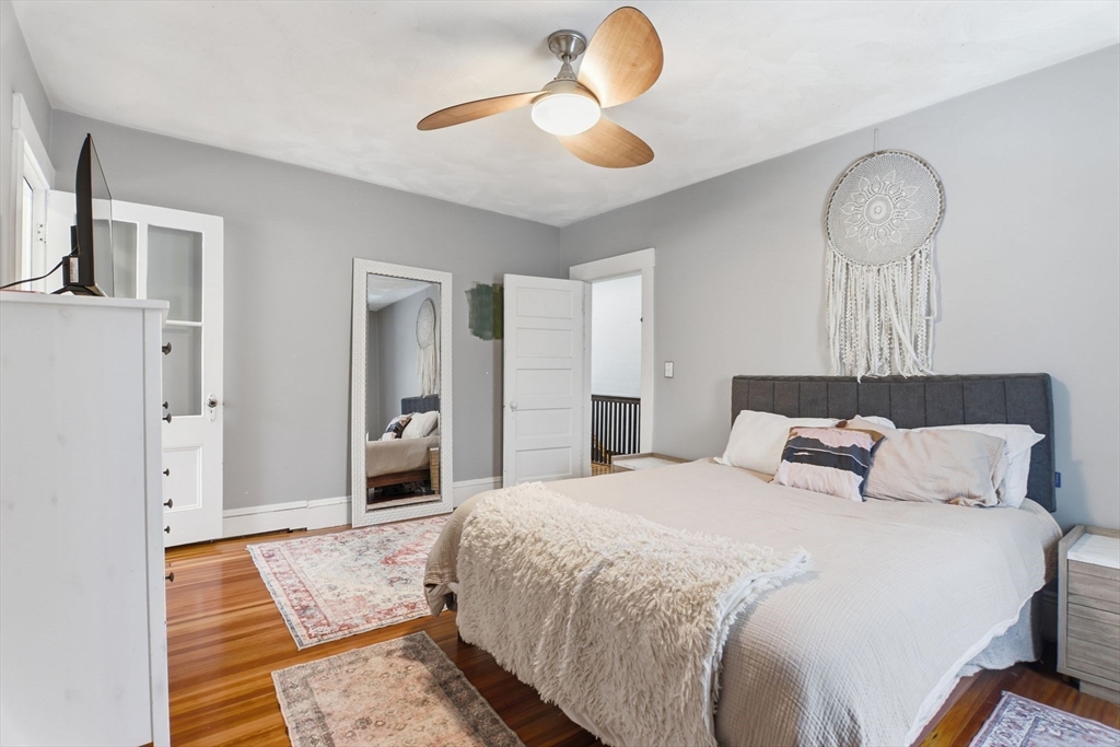 141 Lincoln Road Longmeadow, MA 01106 - Photo 12 of 26 a bedroom with bed and a chandelier