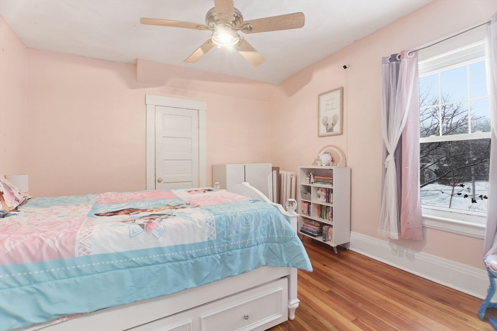 141 Lincoln Road Longmeadow, MA 01106 - Photo 14 of 26 a bedroom with a bed and wooden floor