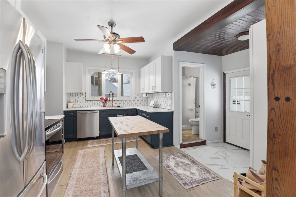 141 Lincoln Road Longmeadow, MA 01106 - Photo 3 of 26 a kitchen with stainless steel appliances kitchen island granite countertop a refrigerator and a sink