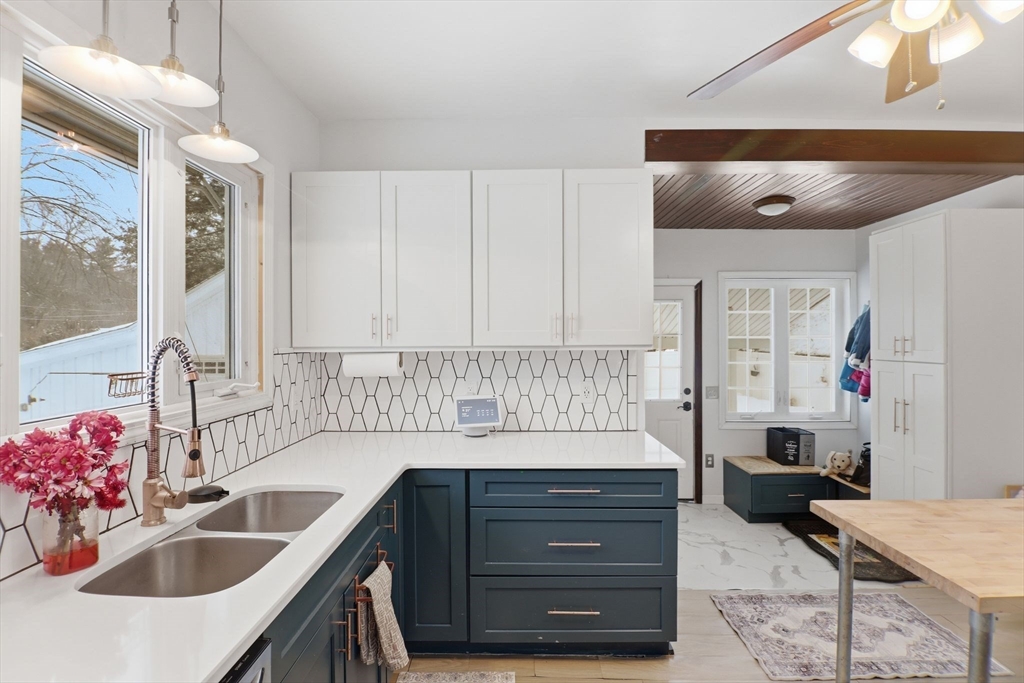 141 Lincoln Road Longmeadow, MA 01106 - Photo 4 of 26 a en suite bathroom with a granite countertop sink and a mirror