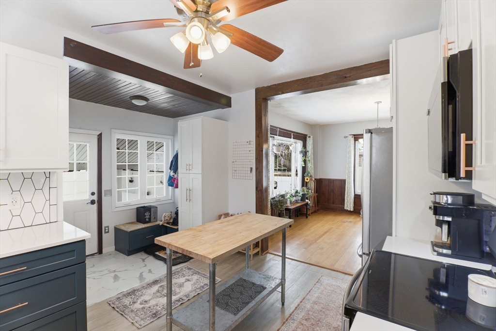 141 Lincoln Road Longmeadow, MA 01106 - Photo 5 of 26 a living room with furniture a flat screen tv and a table