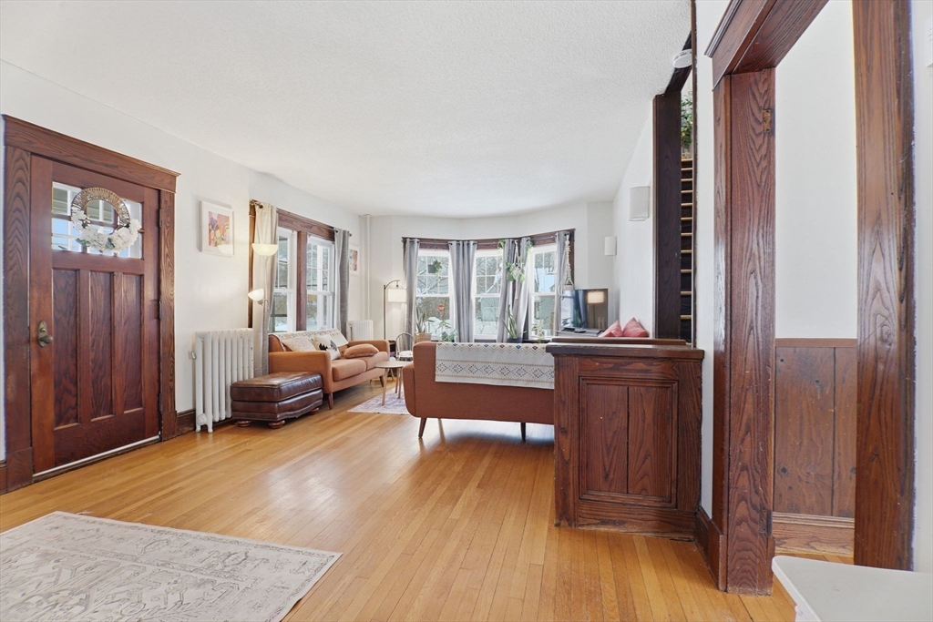 141 Lincoln Road Longmeadow, MA 01106 - Photo 8 of 26 a living room with furniture and a wooden floor