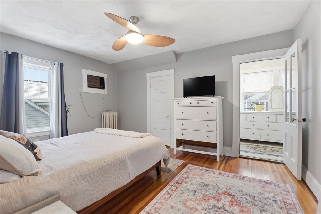 141 Lincoln Road Longmeadow, MA 01106 - Photo 10 of 26 a bedroom with a bed and a television