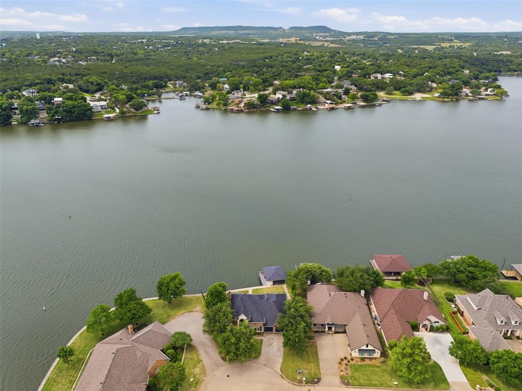 2406 River Road Granbury, TX 76048 - Photo 37 of 40 Aerial perspective showcasing waterfront properties and surrounding natural landscape